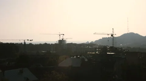 Abstract Industrial background with construction cranes silhouettes over amazing Stock Footage 66300100