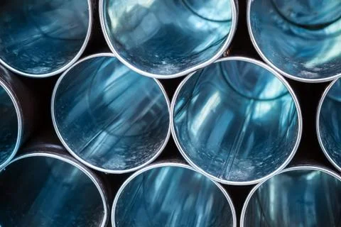 Abstract industrial background, empty blue metal tubes Stockfoto's