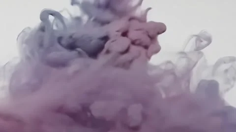 Abstract Ink Dropping Into Water Creating Swirling Clouds Stock Footage 313324280