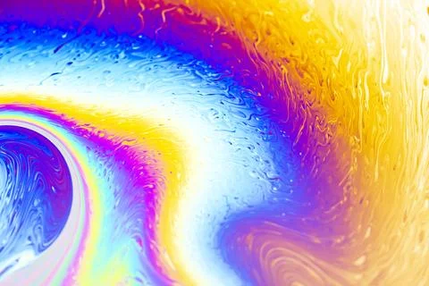 Abstract iridescent soap bubble surface with swirling rainbow colors and pa.. Stock-Fotos