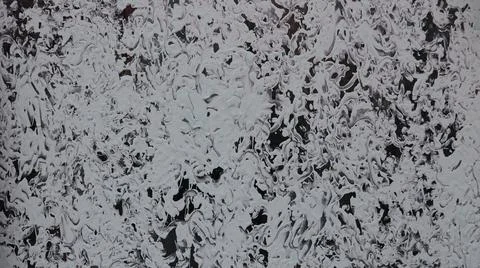 Abstract lace pattern with paint on a dark surface Stock Photos