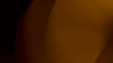 Abstract large amber light leaks overlay background on black screen Stock Footage 345960653