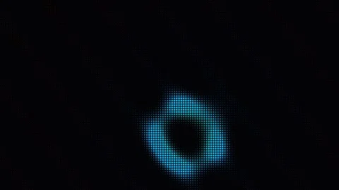 Abstract LED halftone circle shifting colors on a dark background Stock Footage 335933851