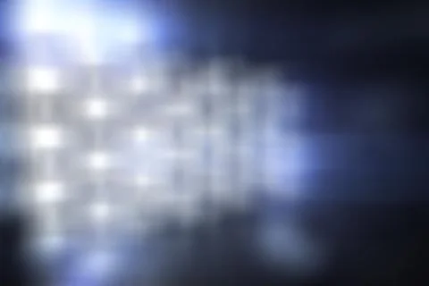 Abstract LED panel grid glowing softly on dark wall in flat design, producing Stock Photos