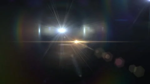 Abstract lens flare light effect. Glowing sun rays with bokeh on dark Stock Footage 340380754