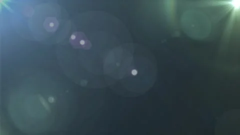 Abstract lens flare light effect on a dark background with soft bokeh Vídeos de archivo 346199572
