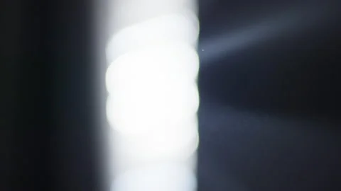Abstract Lens Flare Light Shining Through Gap Extreme Close up 4K Stock Footage 170981828