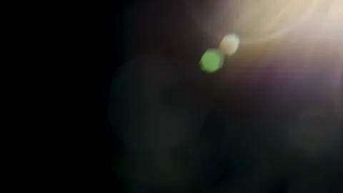 Abstract lens flare reflections and colorful light leaks on black background Stock Footage 345960739