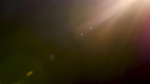Abstract Lens Flares on Dark Background for Cinematic Overlays Stock Footage 325824436
