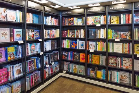 Abstract library background with rows of books on display. London, UK, 8 June Stock Photos