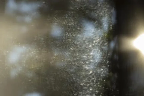 Abstract light and shadow patterns created by sunlight filtering through a Stock Photos