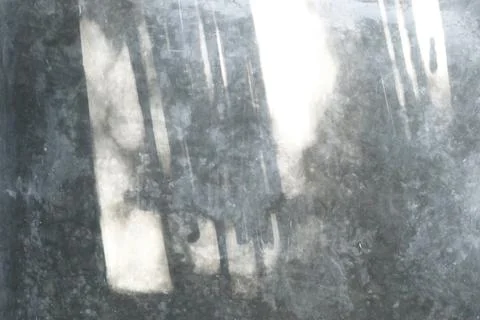 Abstract light and shadow play on a weathered gray textured surface Stock Photos