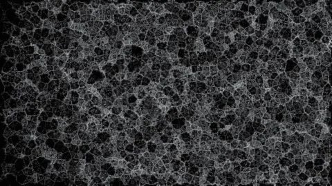 Abstract light bloom forms in dark expanse with subtle grainy texture durin.. Stock Footage 342521779