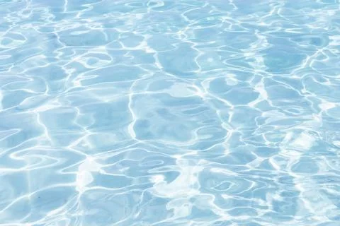 Abstract light blue colored water with ripples on the surface. Water with s.. Stock Photos