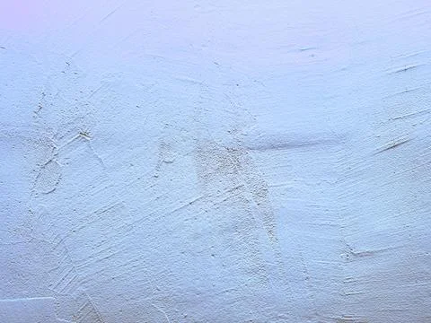 Abstract light blue plaster wall texture featuring subtle brown scratch mar.. Stock Photos