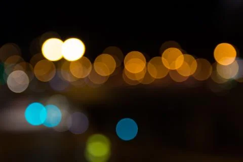 Abstract Light Bokeh Background. Defocused night traffic lights Stock Photos