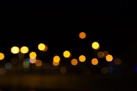 Abstract Light Bokeh Background. Defocused night traffic lights Stock Photos