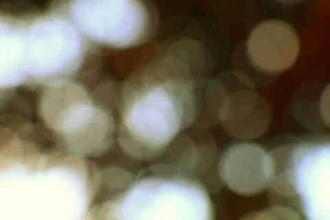Abstract Light Bokeh Effect with Warm Tones and Circular Shapes Stock Photos