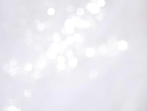 Abstract light bokeh like falling snow. Winter background. Illustrazione stock