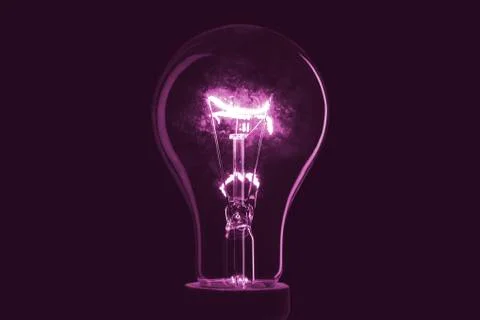 Abstract light bulb on the black background. Lamp light in the dark. Electric Foto stock