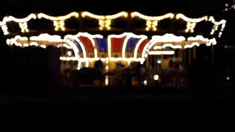 Abstract light carousel at night; Blur Carousel and bokeh of light Stock Footage 125164800