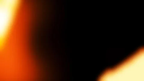 Abstract light leak overlay with glowing orange and yellow gradient Stock Photos