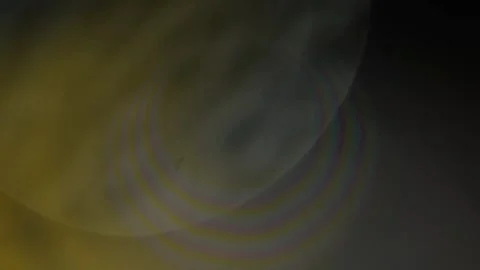 Abstract light leaks overlay featuring soft circular lens flares against dark Video stock 345332534