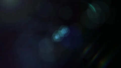 Abstract Light Leaks Overlaying Dark Background with Cinematic Blue Lens Flare Stock Footage 338368990