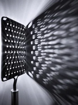 Abstract Light Pattern From Vegetable Grater Black And White Foto stock