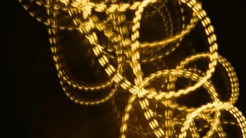 Abstract light patterns with golden circles on a dark background Stock Photos