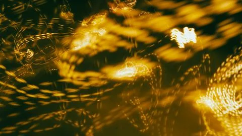 Abstract light patterns with swirling golden hues and blurred motion effects Stock Photos