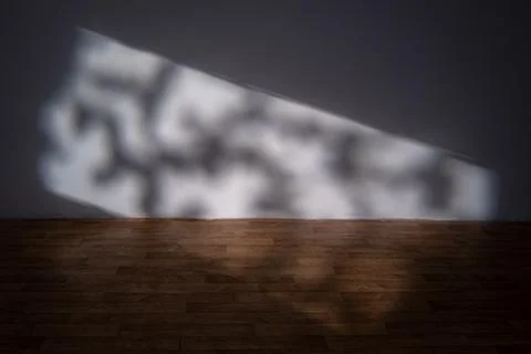 Abstract light projection on studio wall and floor Foto stock