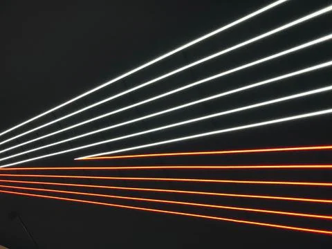 Abstract light rainbow trails in random motion background image. Striped Neon Stock Photos