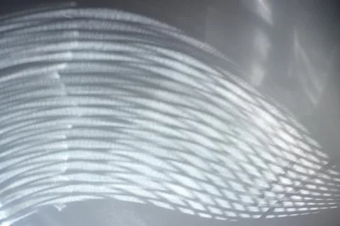 Abstract light reflection and refraction pattern on shiny surface. Stock Photos