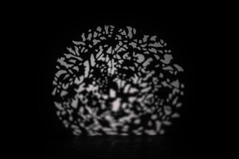 Abstract light spots pattern on dark surface Foto stock