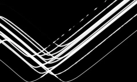 Abstract light trails on black background. Glowing neon lines forming a geo.. Stock Illustration