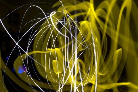 Abstract light trails on a black background, closeup of photo Stock Photos