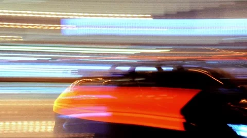 Abstract light trails of a car driving at night in the city Stock Footage 319043769