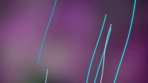 Abstract light trails on purple backdrop Stock Footage 329835876