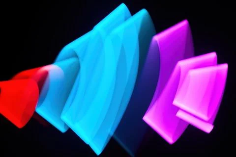 Abstract Light Waves. Colorful light pattern with flowing shapes in blue, pink Stock Photos