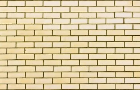 Abstract of a light yellow brick wall background Stock Photos
