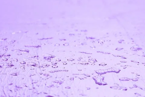 Abstract lilac blurry background with water droplets Stock Photos