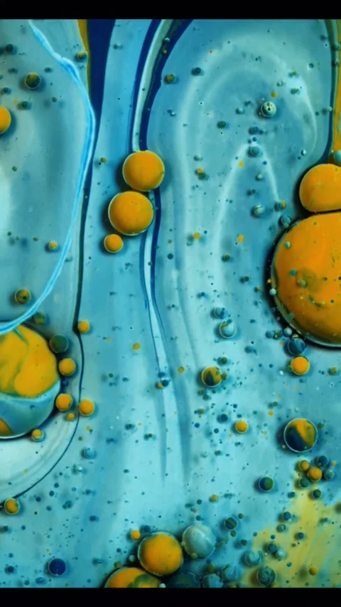 Abstract liquid background with blue and yellow oil bubbles moving in a slow Video stock 347692050