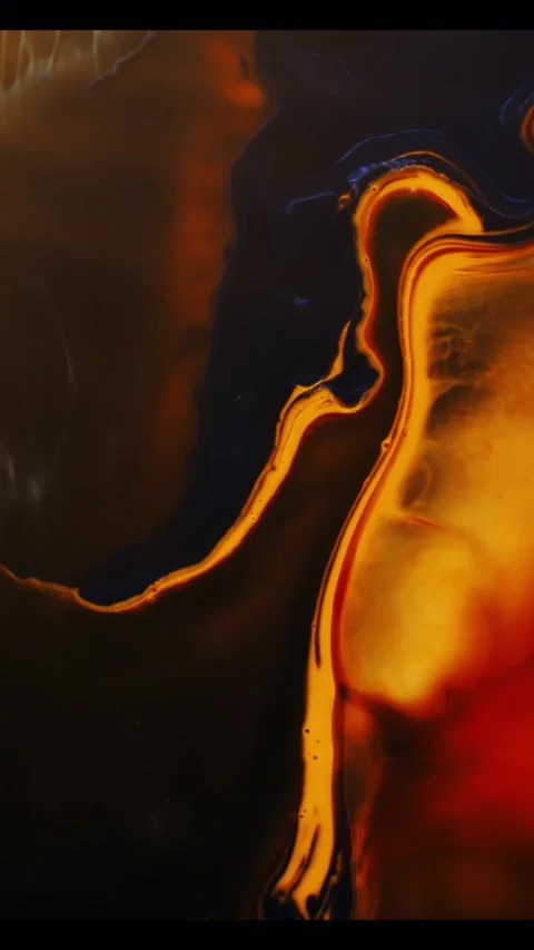 Abstract liquid motion with flowing orange and black paint swirls for creative Stock-Footage 347692628