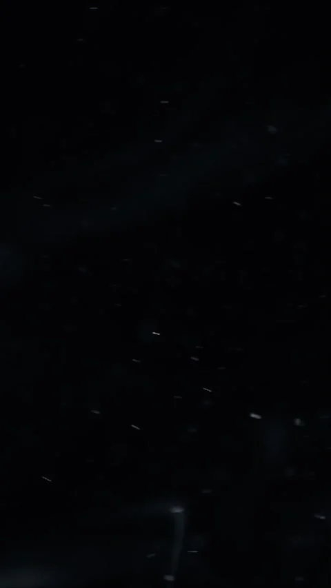 Abstract liquid motion with glowing particles floating in dark space for Stock Footage 347692257