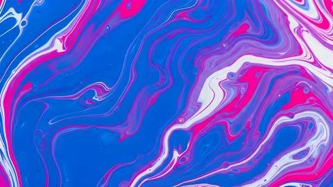 Abstract liquid paint marble background with swirling blue purple and pink .. Fotos de archivo