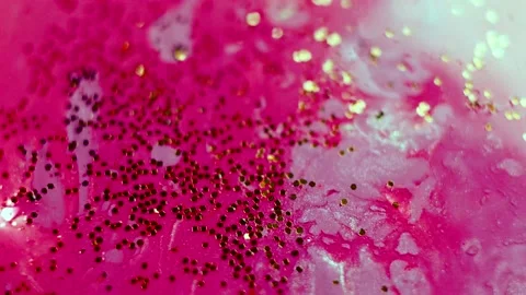 Abstract liquid pink background with gold glitter elements. Stock Footage 134775718