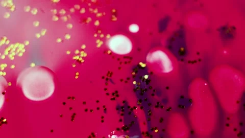Abstract liquid pink background with gold glitter elements. Stock Footage 135388102