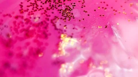 Abstract liquid pink background with gold glitter elements. Stock Footage 136150802