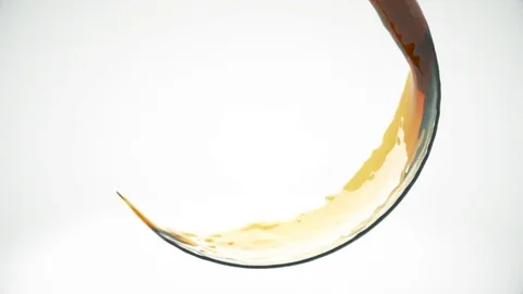 Abstract liquid pouring into frame. Isolated on a white background. Video stock 84125578